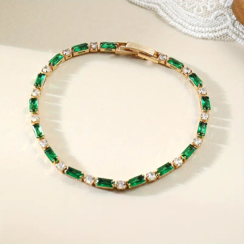 Bracelet de tennis alterné en or et émeraude — Groumia