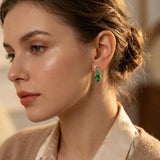 Boucles d'oreilles pendantes en or et émeraudes — Groumia
