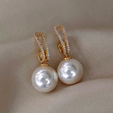 Boucles d'oreilles élégantes avec perles et zirconium — Groumia