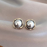 Boucles d'oreilles élégantes en perle noire — Groumia