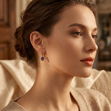 Boucles d'oreilles en couronne d'améthyste dorée — Groumia